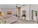 Spacious bedroom with neutral carpeting, a ceiling fan, and access to the hallway through a doorway at 1316 Cambron Dr, Valrico, FL 33596