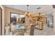 Bright dining area features a glass table and chairs, and sliding glass doors to the patio at 1316 Cambron Dr, Valrico, FL 33596