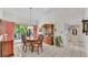 Bright dining room features a stylish table set with a view to the garden at 1316 Cambron Dr, Valrico, FL 33596