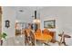 Dining room with decorative light fixture flows into living area at 1316 Cambron Dr, Valrico, FL 33596
