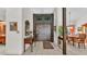 Spacious foyer with tiled flooring, a decorative rug, and a grand wooden double-door entryway at 1316 Cambron Dr, Valrico, FL 33596