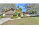 Charming single-Gathering home featuring a well-manicured lawn and attached two-car garage at 1316 Cambron Dr, Valrico, FL 33596