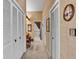 Hallway with ample closet space leads to bath with vanity area and tile shower at 1316 Cambron Dr, Valrico, FL 33596