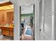 View down hallway into home office with built-in desk and storage at 1316 Cambron Dr, Valrico, FL 33596