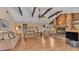 Spacious living room featuring a stone fireplace, vaulted ceilings, and wood accents at 1316 Cambron Dr, Valrico, FL 33596