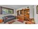Comfortable living room with wooden bookshelves and a window, and a small blue sofa at 1316 Cambron Dr, Valrico, FL 33596