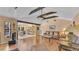 Bright living room featuring vaulted ceilings with exposed wood beams and hardwood floors at 1316 Cambron Dr, Valrico, FL 33596
