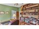 Cozy home office with hardwood floors and custom built-in shelving at 1316 Cambron Dr, Valrico, FL 33596