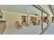Covered patio area that offers shade and space for dining and lounging near the pool at 1316 Cambron Dr, Valrico, FL 33596