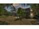 A lovely screened in pool with lush landscaping and mature trees at 1316 Cambron Dr, Valrico, FL 33596
