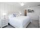 Bright bedroom features a ceiling fan, carpeted floors, and stylish decorative wall art at 2767 Walden Town Cir, Plant City, FL 33566