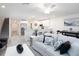 Open-concept living space with modern furnishings and a breakfast bar at 2767 Walden Town Cir, Plant City, FL 33566