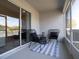 Relaxing screened patio with chairs and a table, perfect for outdoor living at 2767 Walden Town Cir, Plant City, FL 33566