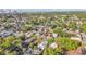 Scenic aerial showing the home amidst a leafy neighborhood with a cityscape backdrop at 3105 N 17Th St, Tampa, FL 33605