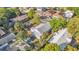 Aerial view showcasing the home's backyard, mature trees, and surrounding neighborhood at 3105 N 17Th St, Tampa, FL 33605