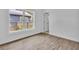 Bright bedroom with a large window, showcasing the wood-look flooring and natural light at 3105 N 17Th St, Tampa, FL 33605