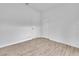 This bedroom has a neutral paint, wood-look floors, and a large closet at 3105 N 17Th St, Tampa, FL 33605