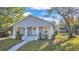 Charming single-story home featuring a welcoming front porch with classic white pillars at 3105 N 17Th St, Tampa, FL 33605