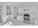 Bright kitchen featuring sleek white cabinetry and stainless steel appliances, open layout at 3105 N 17Th St, Tampa, FL 33605