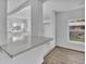 Bright, open kitchen featuring white countertops and cabinetry, offering a clean and contemporary feel at 3105 N 17Th St, Tampa, FL 33605