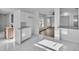 Open concept kitchen featuring sleek cabinetry, marble floors, and stainless steel appliances at 3105 N 17Th St, Tampa, FL 33605