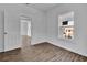 Living room displays wood-look floors and plenty of sunlight through a window at 3105 N 17Th St, Tampa, FL 33605