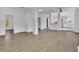 Open-concept living area with wood-look flooring, modern ceiling, and neutral walls, perfect for entertaining at 3105 N 17Th St, Tampa, FL 33605