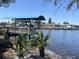 Private boat dock with lift situated on a canal, offering easy access to boating and water activities at 5903 Cachette De Riviera Ct, New Port Richey, FL 34655