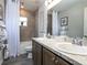 Inviting bathroom featuring a shower-tub combo, vanity with double sinks, tile flooring, and neutral wall colors at 7076 162Nd E Pl, Parrish, FL 34219