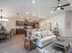 Spacious living area with neutral tones, hardwood floors, lots of natural light and open to the kitchen at 7076 162Nd E Pl, Parrish, FL 34219
