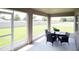 Spacious screened patio with a view of the backyard, perfect for outdoor dining and entertaining at 7076 162Nd E Pl, Parrish, FL 34219