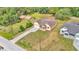Aerial view of a home with a long driveway and green lawn at 12500 Green Oak Ln, Dade City, FL 33525