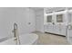 Bright bathroom featuring double sink vanity and soaking tub at 12500 Green Oak Ln, Dade City, FL 33525