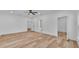 Bright open bedroom with wood floors and multiple entryways at 12500 Green Oak Ln, Dade City, FL 33525