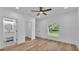 Bedroom with hardwood flooring, ceiling fan, and natural light at 12500 Green Oak Ln, Dade City, FL 33525