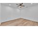 Bright bedroom with wood floors, recessed lights, and ceiling fan at 12500 Green Oak Ln, Dade City, FL 33525