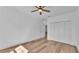 Bright bedroom features wood floors, a closet, and ceiling fan at 12500 Green Oak Ln, Dade City, FL 33525