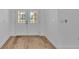 Bright entryway with wood-look flooring and double front doors at 12500 Green Oak Ln, Dade City, FL 33525