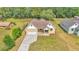 Charming single-Gathering home with inviting front porch and manicured lawn at 12500 Green Oak Ln, Dade City, FL 33525