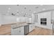 Open-concept kitchen with a large island, stainless steel appliances, and seamless access to living areas at 12500 Green Oak Ln, Dade City, FL 33525