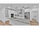 Modern kitchen with stainless steel appliances, granite countertops and white cabinets at 12500 Green Oak Ln, Dade City, FL 33525