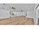 Open-concept living area featuring wood flooring and recessed lighting at 12500 Green Oak Ln, Dade City, FL 33525