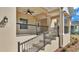 Inviting front porch with stylish railings and exterior lighting at 12500 Green Oak Ln, Dade City, FL 33525