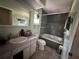 Bathroom with a shower and bathtub combo at 3133 Washington Rd, Valrico, FL 33594