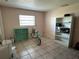 Bedroom with a bicycle, a window, and a bookshelf at 3133 Washington Rd, Valrico, FL 33594