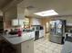 Kitchen with stainless steel refrigerator and breakfast bar at 3133 Washington Rd, Valrico, FL 33594