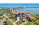 Scenic aerial view of the condo building complex near the water with lush greenery and meticulous landscaping at 6158 Palma Del Mar S Blvd # 604, St Petersburg, FL 33715