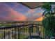 Balcony view featuring an outdoor chair and an impressive sunset and cityscape at 6158 Palma Del Mar S Blvd # 604, St Petersburg, FL 33715