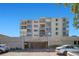 Exterior view of building with well-maintained landscaping and covered parking at 6158 Palma Del Mar S Blvd # 604, St Petersburg, FL 33715