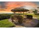 Charming thatched gazebo offers a relaxing outdoor space with ocean views at sunset at 6158 Palma Del Mar S Blvd # 604, St Petersburg, FL 33715